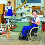 worker in wheelchair in a carpenter’s workshop