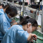 118464464-asian-chinese-electronics-factory-workers-female-industry-manufacturing-assembly-line