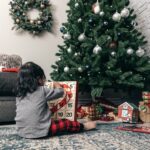 child-opens-advent-calendar-on-christmas-morning