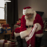 santa-claus-preparing-his-bag-gifts