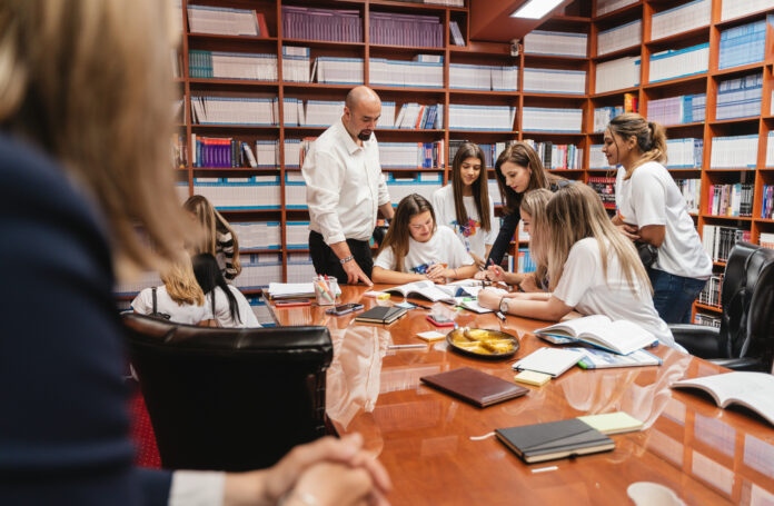 A diverse group of students and professors engaged in various academic activities and collaborative learning.